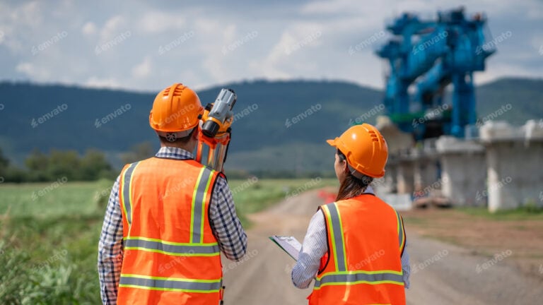 Bridge construction project with steel framework and heavy equipment